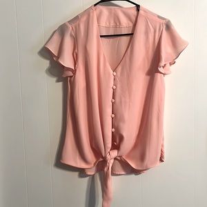 Sheer light pink blouse.